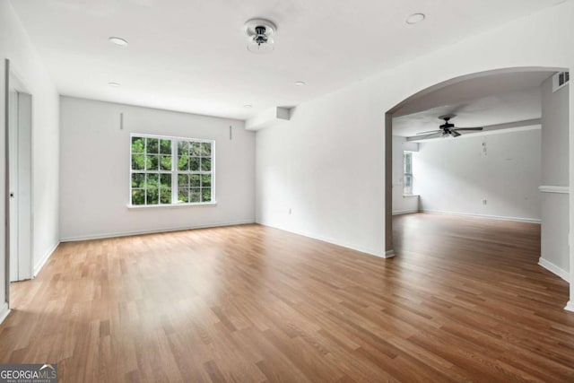 spare room featuring light hardwood / wood-style floors and ceiling fan