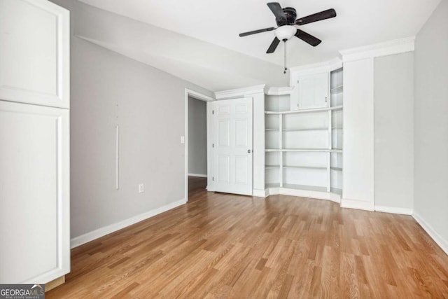 unfurnished bedroom with light hardwood / wood-style flooring, ceiling fan, and crown molding