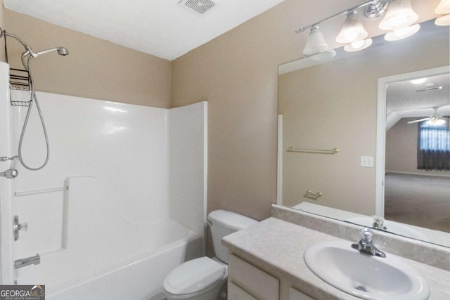 full bathroom with a textured ceiling, vanity,  shower combination, ceiling fan, and toilet