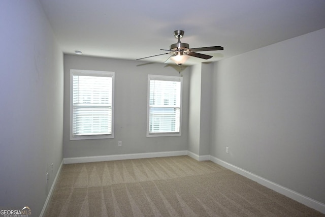 carpeted empty room with ceiling fan