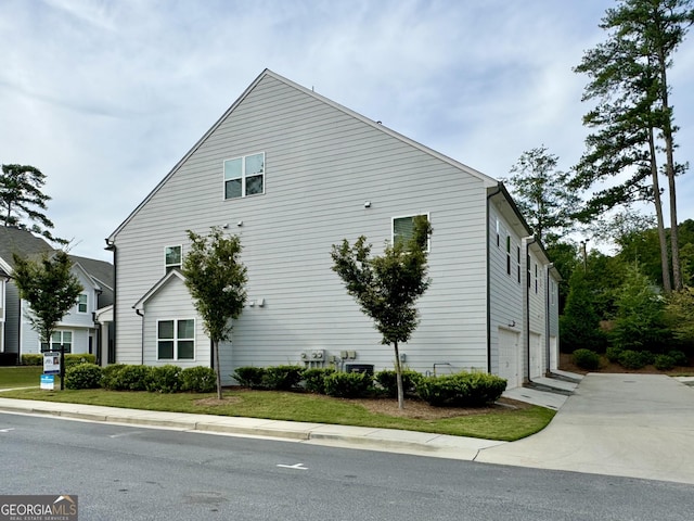 view of side of property with a garage