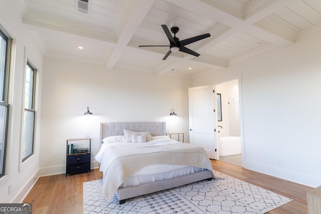 bedroom featuring ceiling fan, beam ceiling, light wood-type flooring, and ensuite bathroom