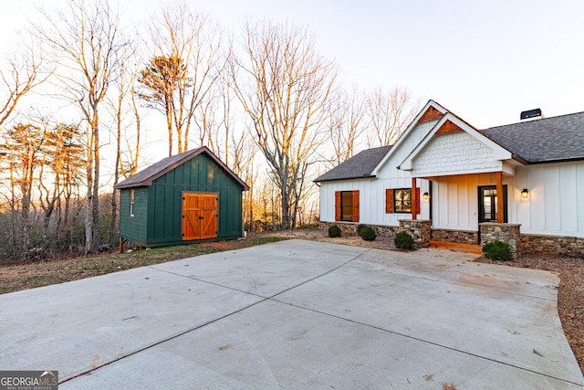 view of front facade with a storage unit