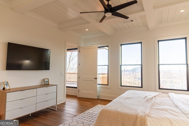 bedroom featuring beamed ceiling, hardwood / wood-style flooring, ceiling fan, and wood ceiling