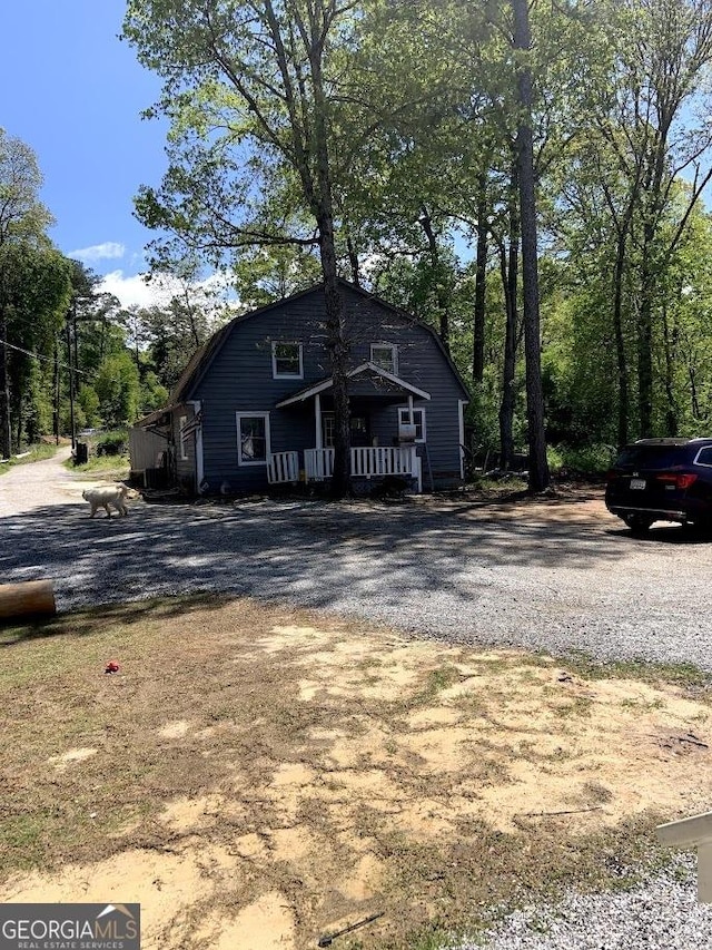 view of front property featuring covered porch