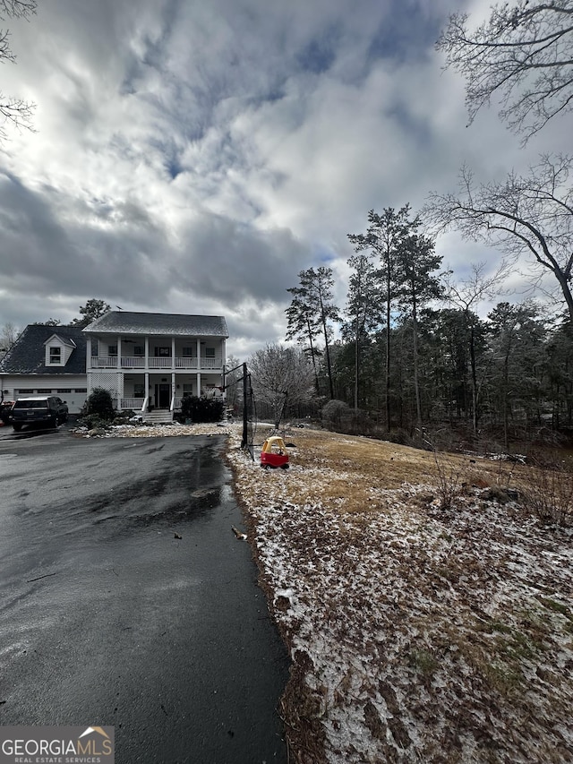 exterior space with a garage and covered porch