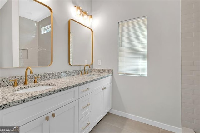 bathroom with tile patterned flooring and vanity