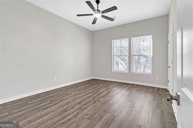 unfurnished room featuring ceiling fan and hardwood / wood-style flooring