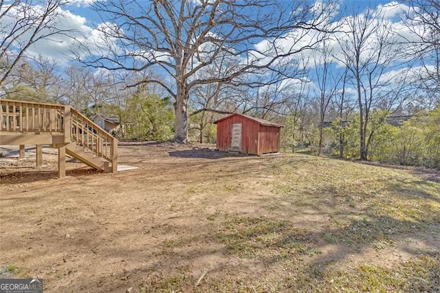 view of yard featuring a shed and a deck