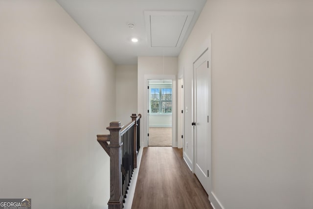 corridor with hardwood / wood-style floors