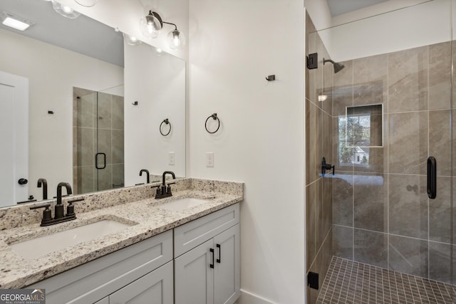 bathroom featuring vanity and a shower with door