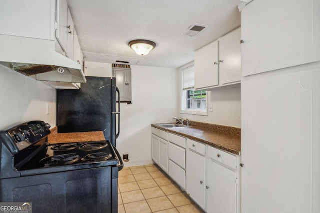 kitchen featuring black appliances, light tile patterned flooring, white cabinetry, and sink