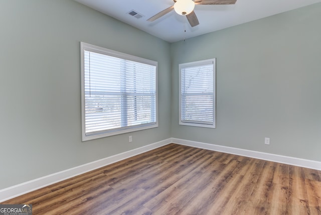 unfurnished room with hardwood / wood-style floors and ceiling fan