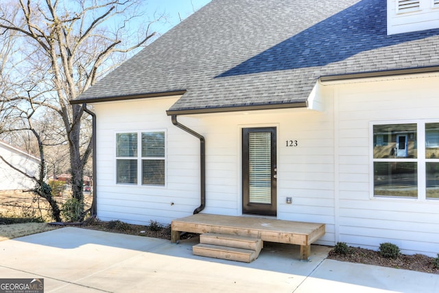 entrance to property featuring a patio area