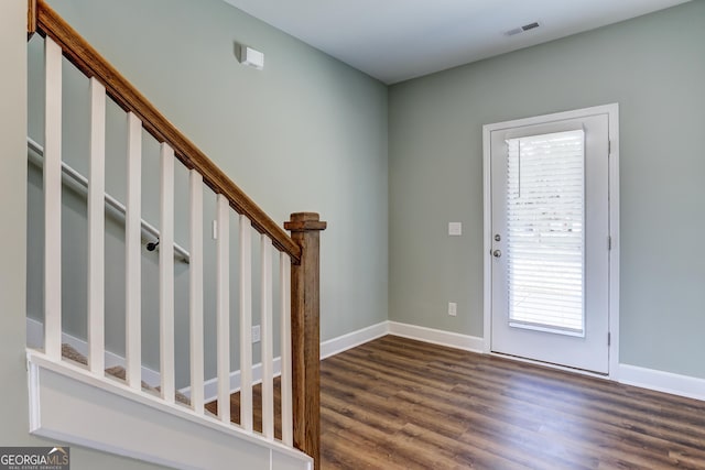 entrance foyer with dark hardwood / wood-style floors