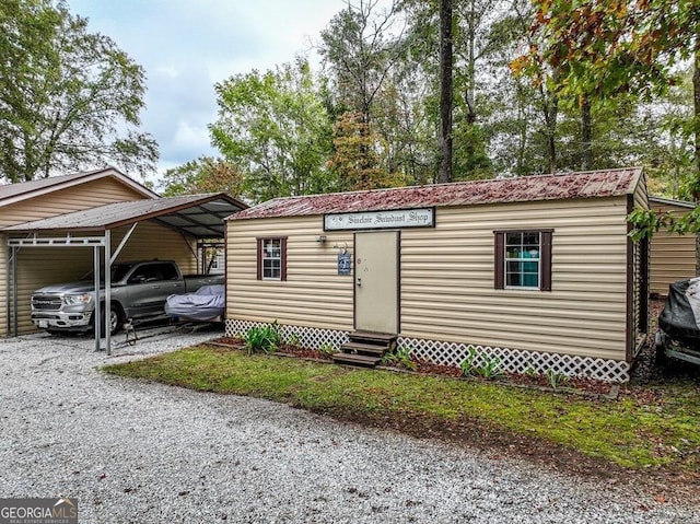 view of front of home with a carport