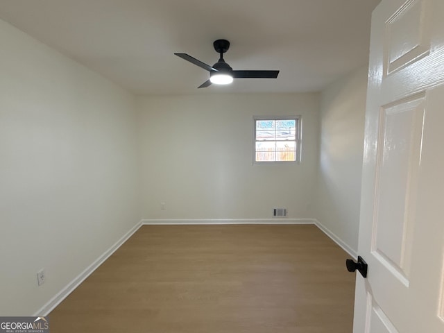 unfurnished room featuring ceiling fan and light wood-type flooring