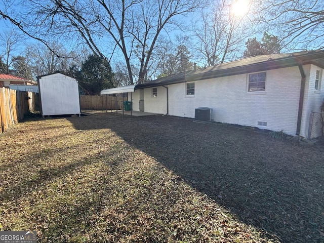 rear view of house featuring a storage unit and cooling unit