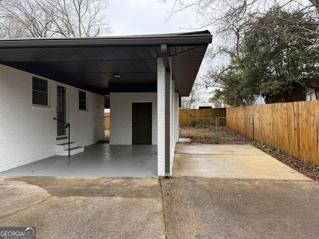 exterior space with a carport