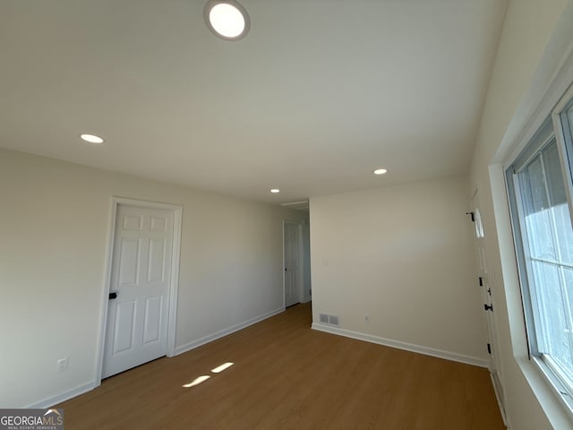 spare room featuring hardwood / wood-style floors