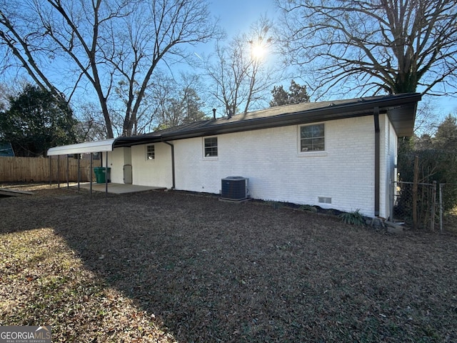 back of house featuring a patio and central air condition unit