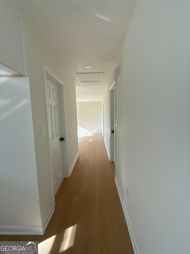 corridor featuring dark wood-type flooring