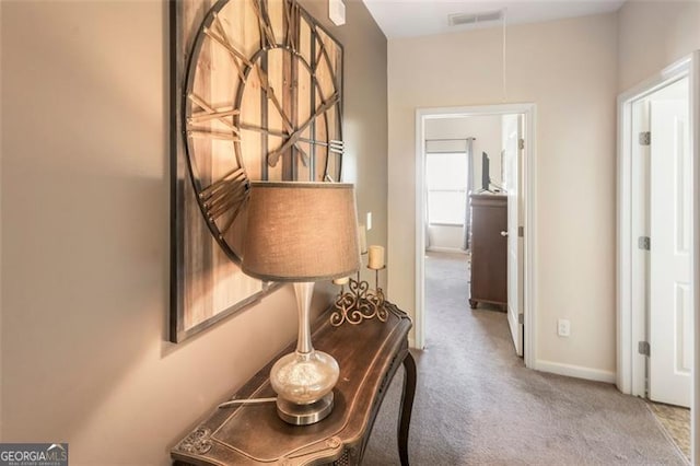 hallway with carpet flooring