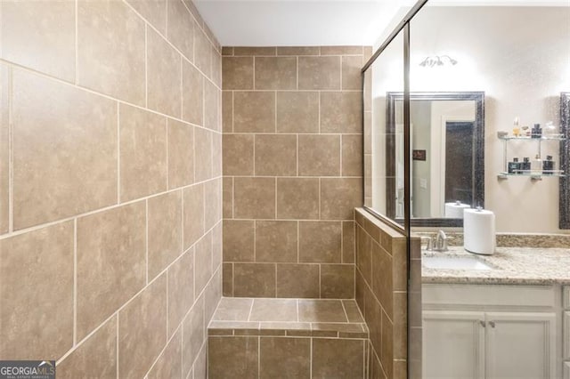 bathroom featuring vanity and walk in shower