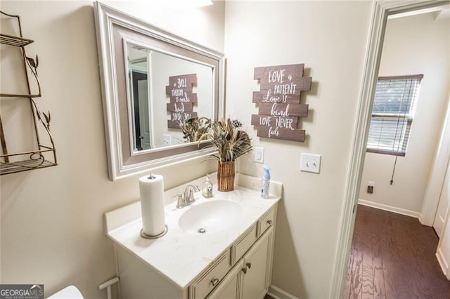 bathroom with vanity and hardwood / wood-style flooring