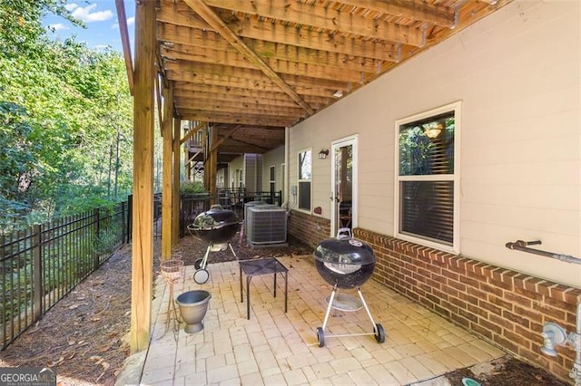 view of patio / terrace featuring a fire pit, grilling area, and central AC