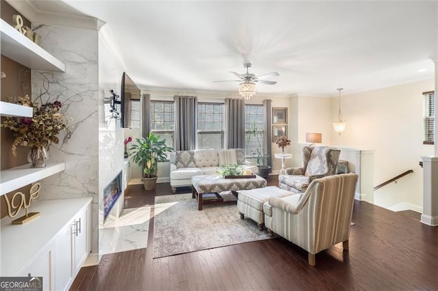 living room with ceiling fan, ornamental molding, and dark wood-type flooring