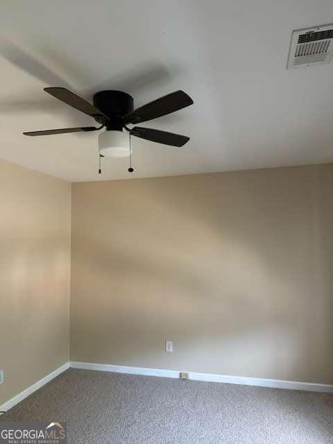 unfurnished room featuring carpet flooring and ceiling fan