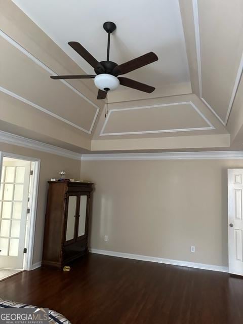 interior details with ceiling fan, wood-type flooring, and ornamental molding