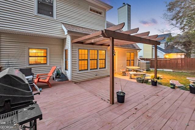 deck at dusk with a pergola