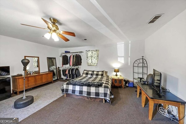 bedroom with ceiling fan and carpet floors