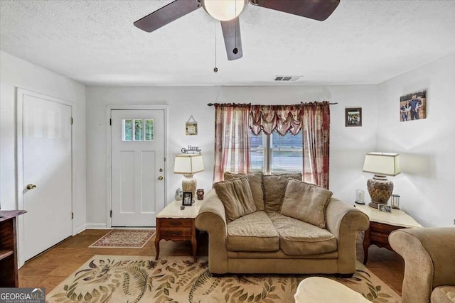 living room with a textured ceiling