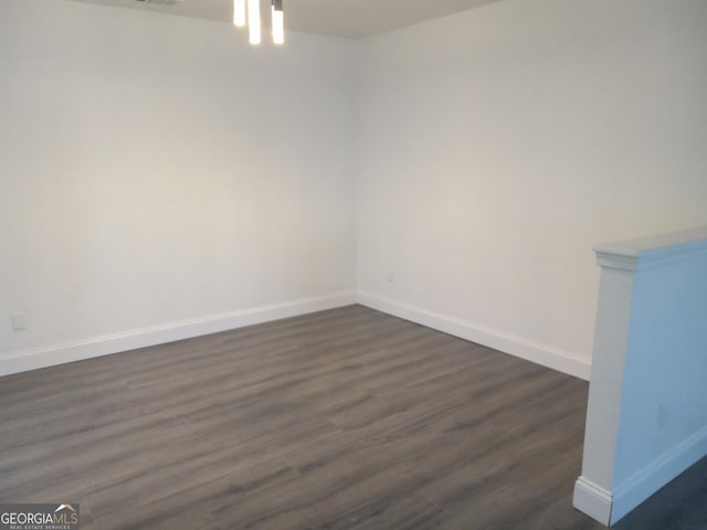 empty room featuring dark hardwood / wood-style floors