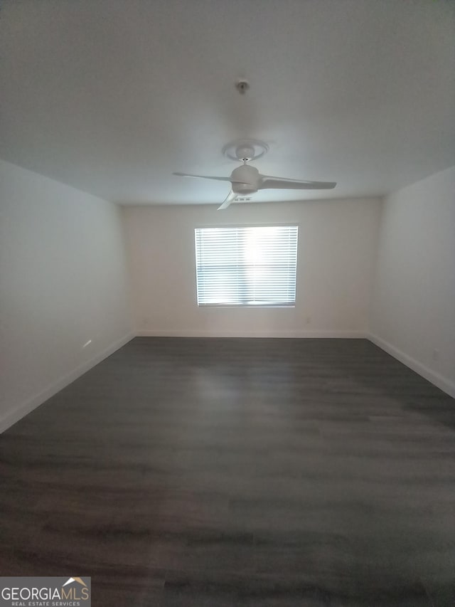 unfurnished room featuring dark hardwood / wood-style floors