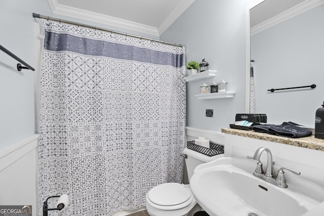 bathroom with crown molding, sink, and toilet