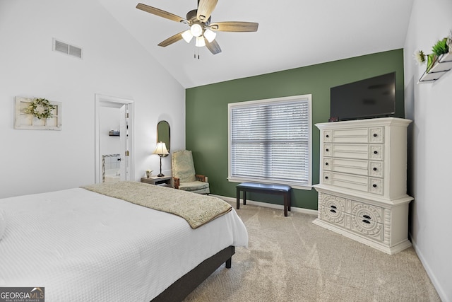 bedroom with connected bathroom, ceiling fan, high vaulted ceiling, and light carpet