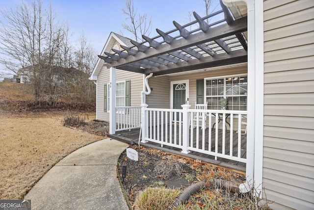 property entrance featuring a pergola