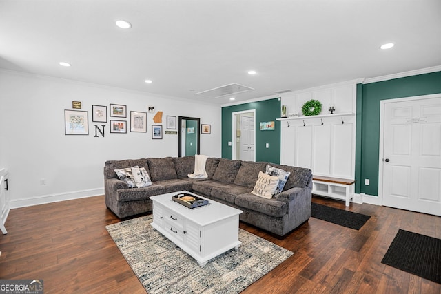 living room featuring dark hardwood / wood-style flooring and crown molding