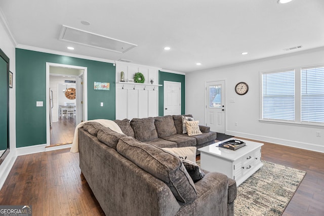 living room with dark hardwood / wood-style floors and crown molding