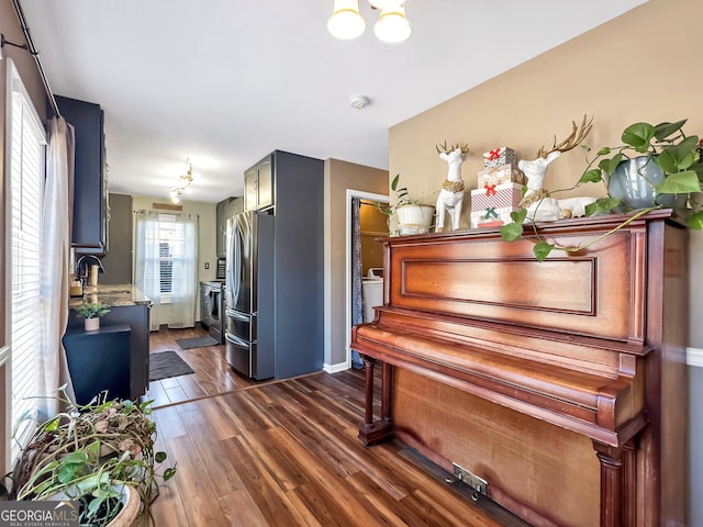 miscellaneous room featuring dark hardwood / wood-style flooring and sink