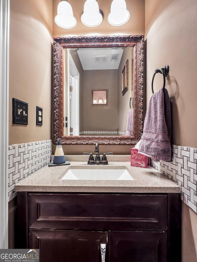 bathroom with backsplash and vanity