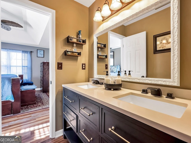 bathroom with vanity and hardwood / wood-style flooring