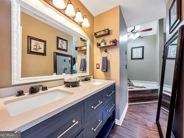 bathroom featuring vanity, hardwood / wood-style flooring, and ceiling fan