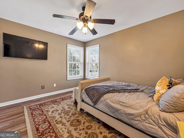 bedroom featuring ceiling fan and wood-type flooring