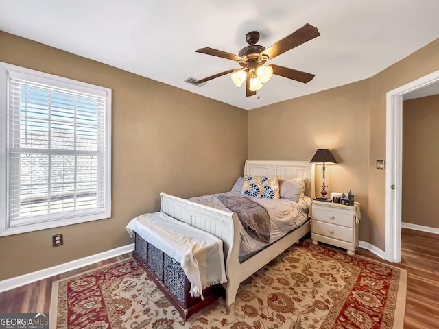 bedroom featuring hardwood / wood-style flooring and ceiling fan