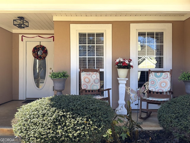 doorway to property with a porch